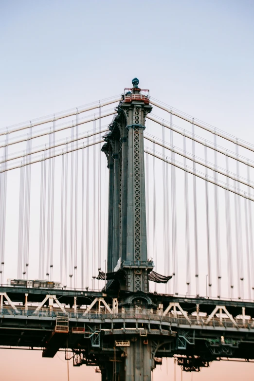 a large bridge over a body of water, trending on unsplash, art nouveau, empire state building, 33mm photo, 🚿🗝📝, industrial aesthetic