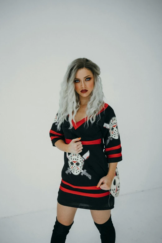 a woman in a black and red dress and knee high boots, inspired by Elsa Bleda, featured on reddit, toyism, with curly black and silver hair, habs jersey, promo image, skulls