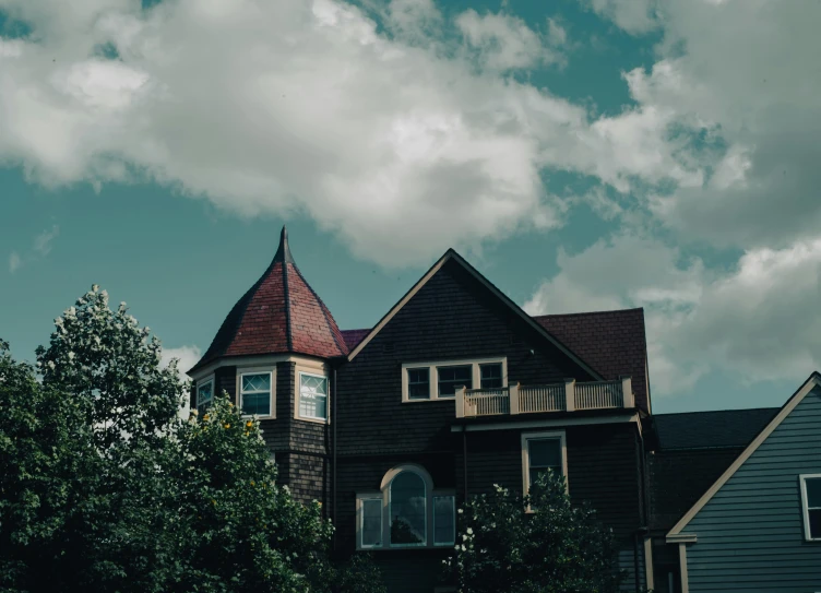 a couple of houses sitting next to each other, by Andrew Stevovich, unsplash contest winner, arts and crafts movement, scary gothic architecture, twin peaks style, exterior view, moody : : wes anderson