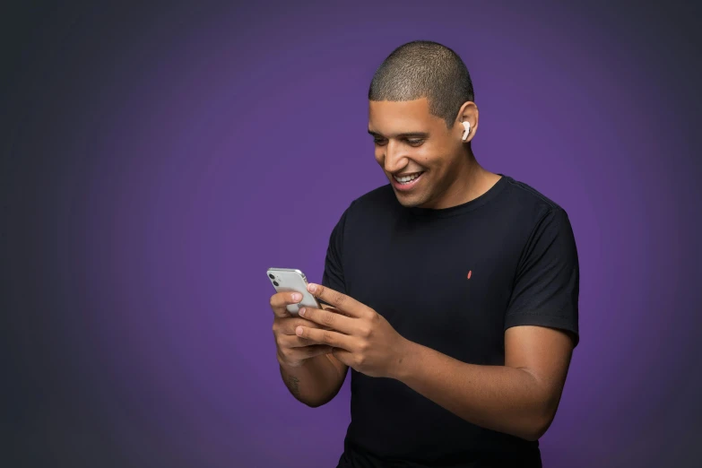 a man smiles while looking at his cell phone, trending on pexels, ((purple)), plain background, airpods, avatar image