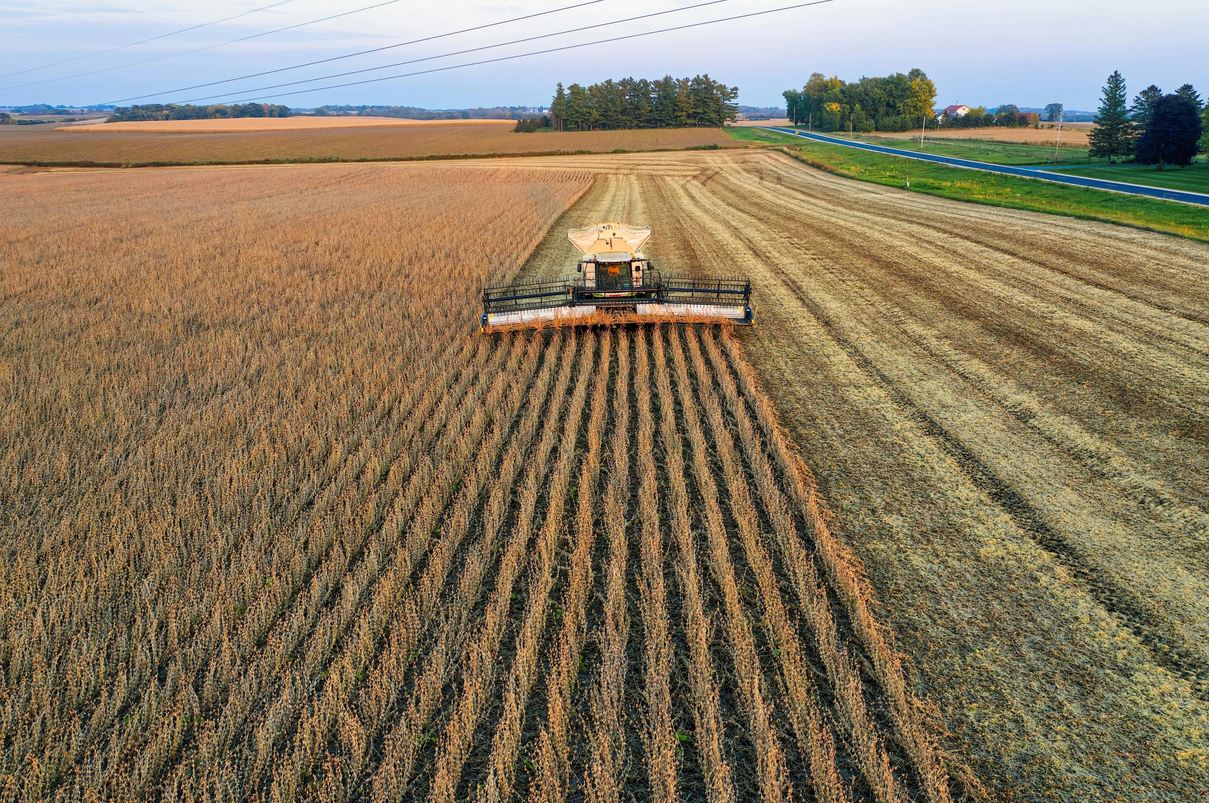 a combine harvester in the middle of a field, by Scott M. Fischer, pexels contest winner, renaissance, bottom angle, heavy line work, wide high angle view, high quality product image”