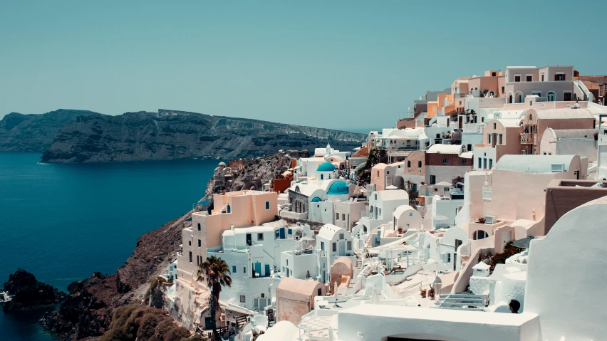 a number of buildings near a body of water, pexels contest winner, neoclassicism, santorini, pink white turquoise, 🦩🪐🐞👩🏻🦳, slide show