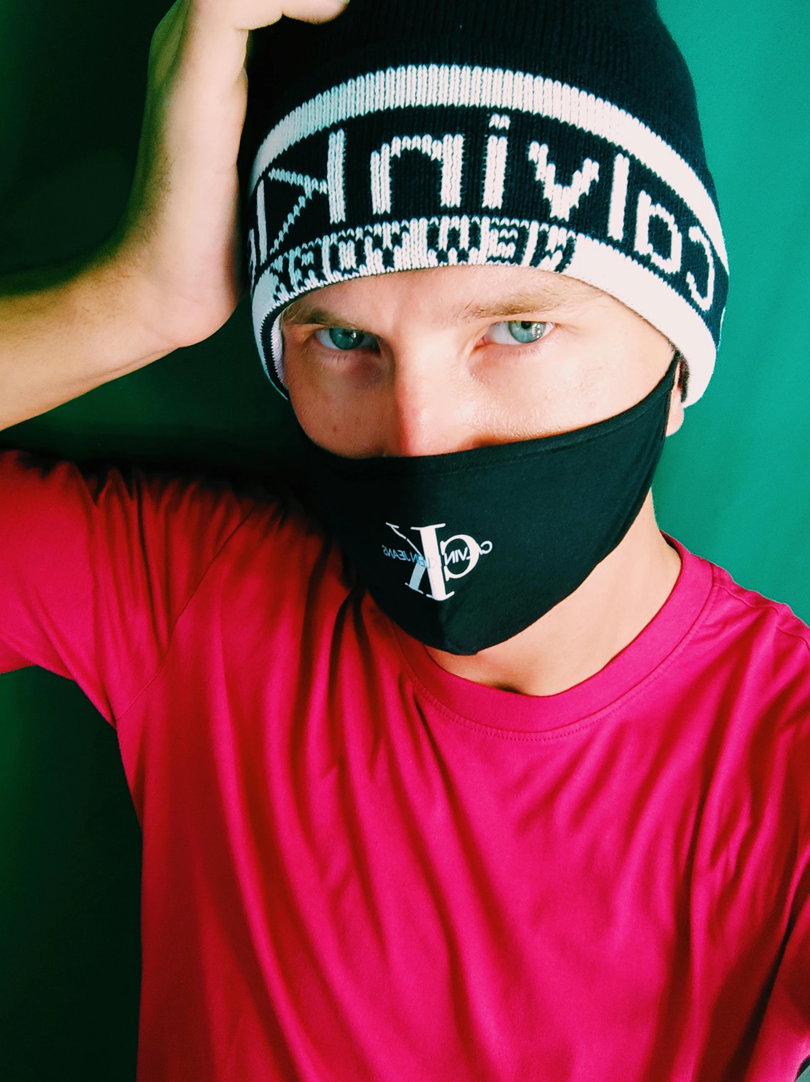 a man wearing a pink shirt and a black face mask, inspired by Anthony Devas, reddit, wearing beanie, threyda, black & white, xqc