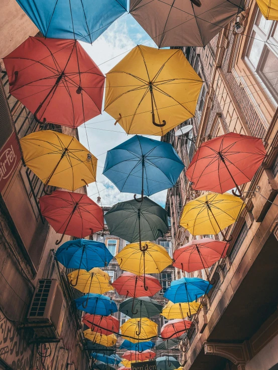 a street filled with lots of colorful umbrellas, an album cover, unsplash contest winner, highly upvoted, alternate album cover, #trending, muted colors