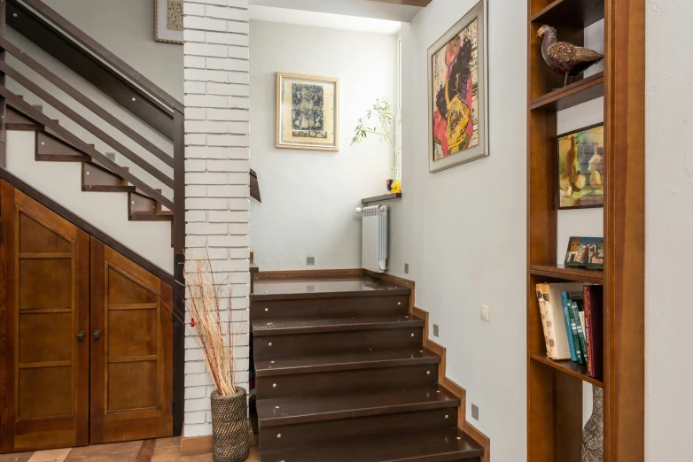 a living room filled with furniture and a staircase, a portrait, by Alexander Fedosav, featured on reddit, wooden stairs, high quality photo, brown:-2, ekaterina