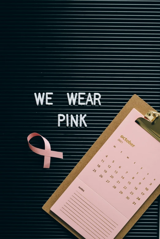 a desktop computer sitting on top of a desk next to a pink ribbon, a photo, trending on pexels, awareness, wearing a pink head band, walk, with a black background