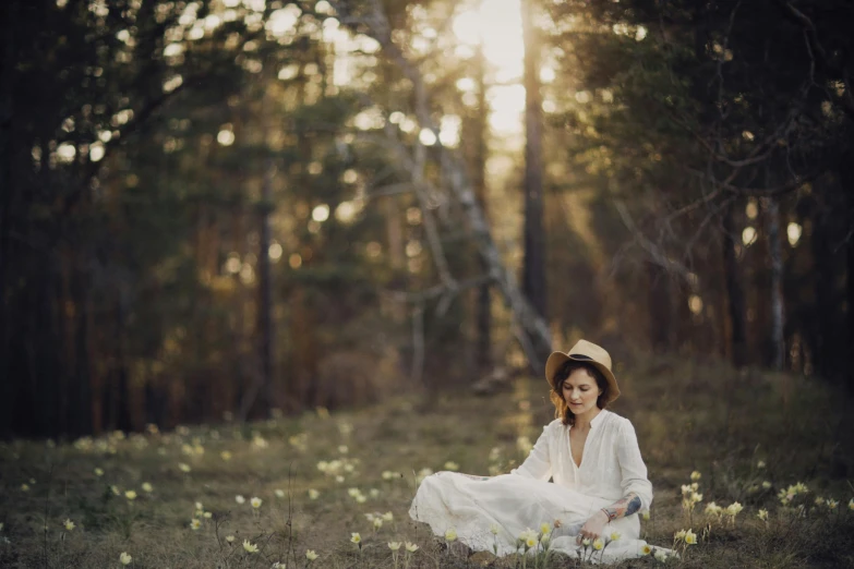 a woman sitting in a field of flowers, inspired by Anka Zhuravleva, pexels contest winner, forest picnic, white, evening sunlight, woman with hat