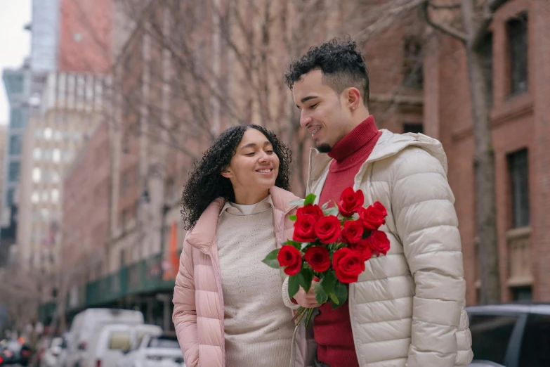 a man holding a bouquet of red roses next to a woman, pexels contest winner, in new york city, 😭🤮 💔, hispanic, wearing red jacket