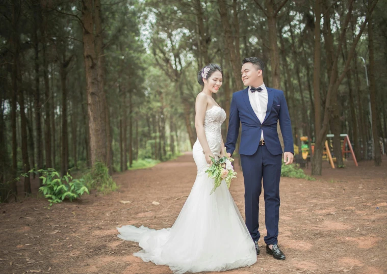 a man and woman standing next to each other in a forest, a picture, by Tan Ting-pho, formal wear, high quality upload, professionally post-processed, white