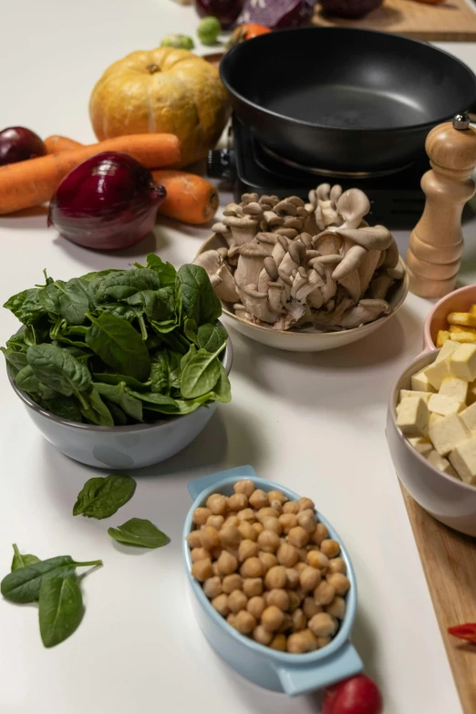 a table topped with lots of different types of food, by Matthias Stom, unsplash, bowl, vegetables, profile image, boiling