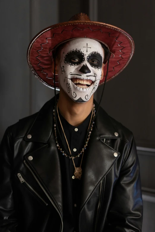 a man wearing a day of the dead mask and a leather jacket, trending on pexels, he is wearing a hat, basquiat, kumadori makeup, slide show