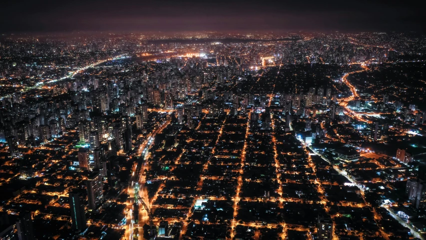 an aerial view of a city at night, by Alejandro Obregón, 8k resolution”, wide open city ”, high quality image”