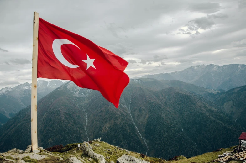 a turkish flag flying on top of a mountain, pexels contest winner, hurufiyya, thumbnail, a high angle shot, profile image, 1 2 9 7