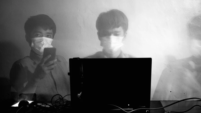 a couple of men standing next to each other in front of a laptop, a black and white photo, by Emma Andijewska, computer art, wearing facemask, shigeto hirai yuya, smog, pc screen image