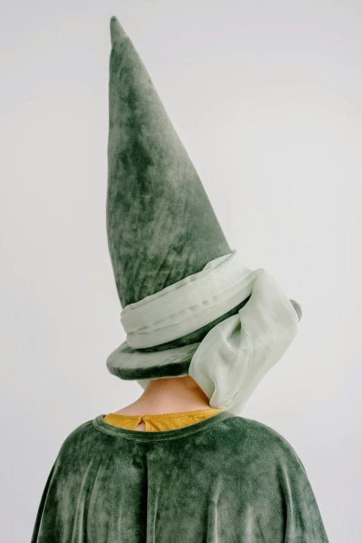 a close up of a person wearing a green hat, inspired by Elsa Beskow, unsplash, renaissance, dunce, ignant, made of silk paper, faceless