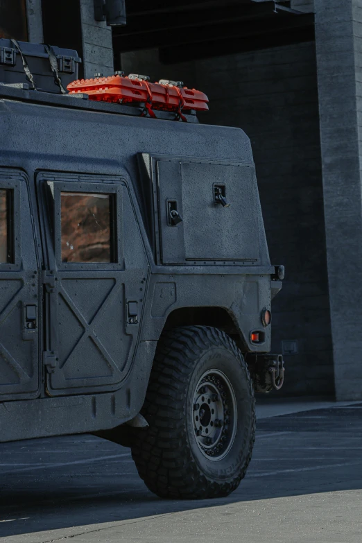 a military vehicle parked in front of a building, a detailed matte painting, pbr textures, game ready, substance designer metal, black tactical gear
