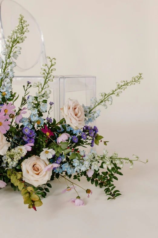 a bunch of flowers sitting on top of a table, romanticism, blue and pink accents, large tall, upclose, floral design