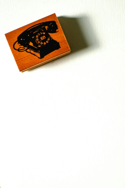 a rubber stamp with a telephone on it, an album cover, by Doug Ohlson, unsplash, private press, 2 5 6 x 2 5 6, wood block pirnt, etsy, wallpaper mobile
