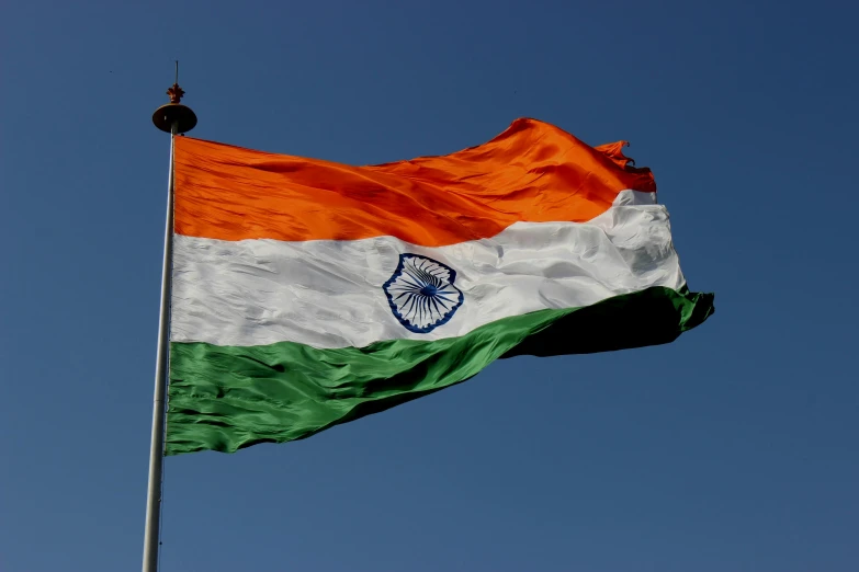 the indian flag is flying high in the sky, a portrait, by Julian Hatton, pexels, square, high quality image, f/3.2, language