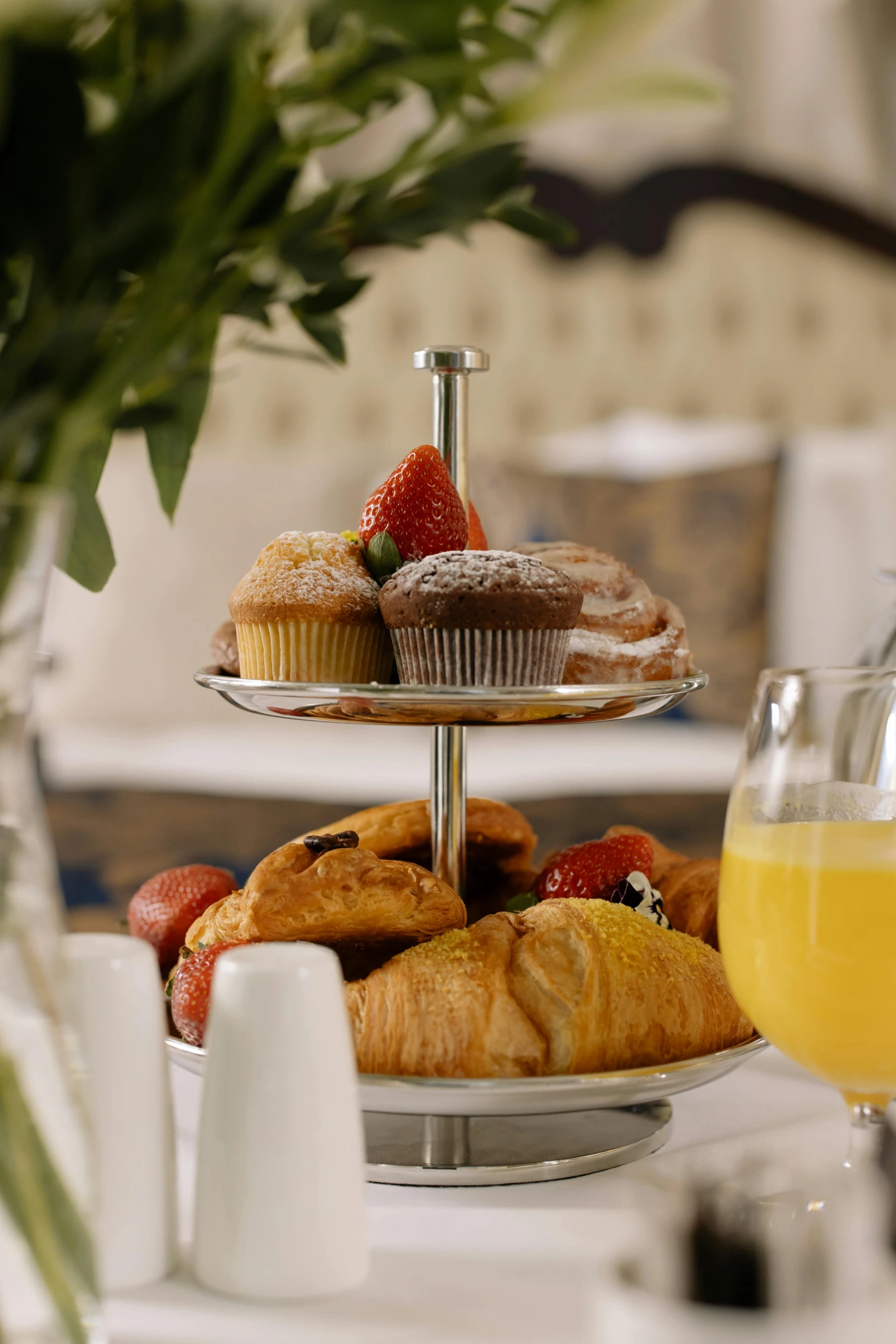 a close up of a plate of food on a table, pastries, cascade, table set for second breakfast, lounge