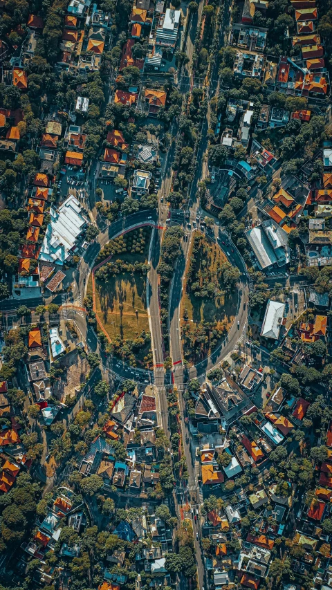 an aerial view of a city surrounded by trees, by Adam Marczyński, unsplash contest winner, everything enclosed in a circle, south jakarta, military, instagram picture