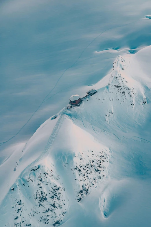 an aerial view of a snow covered mountain, pexels contest winner, cafe in the clouds, whistler, iceland landscape, 2 0 0 0's photo