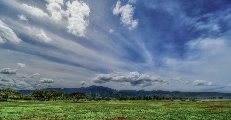 a grassy field with mountains in the background, stormy snowy fiji mountain, a park, hdr on, instagram photo