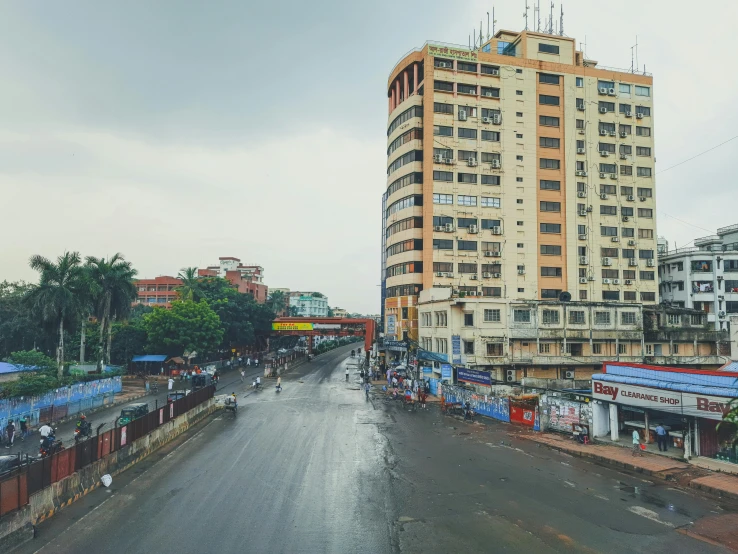 a city street filled with lots of tall buildings, pexels contest winner, bengal school of art, faded and dusty, panorama view, fan favorite, assamese aesthetic