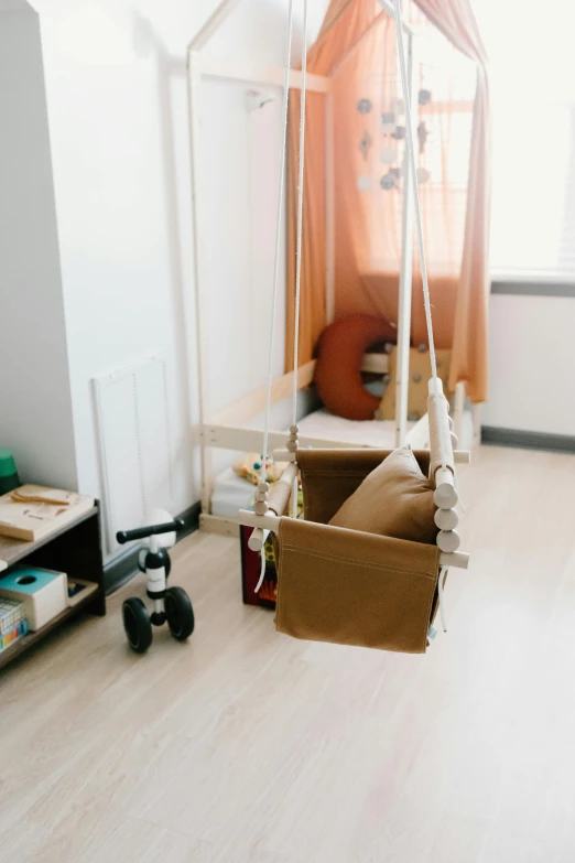 a room with a swing in the middle of it, profile image, brown, small room, toy room