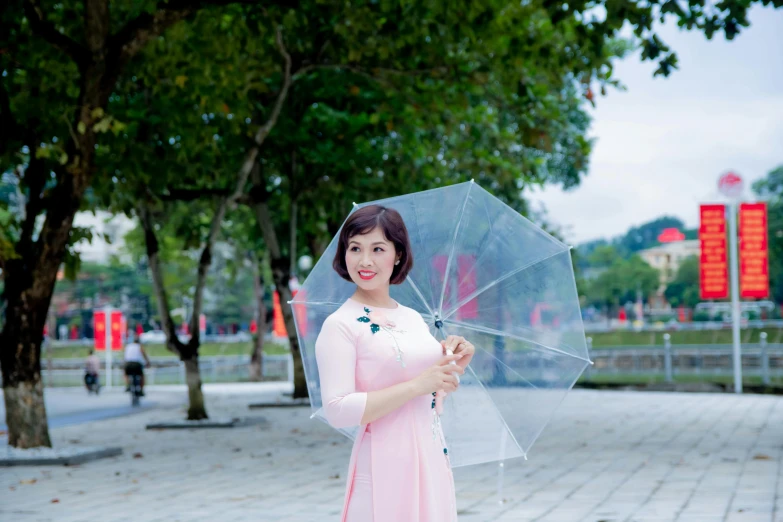 a woman in a pink dress holding a clear umbrella, inspired by Cui Bai, pexels contest winner, avatar image, vietnam, white, square