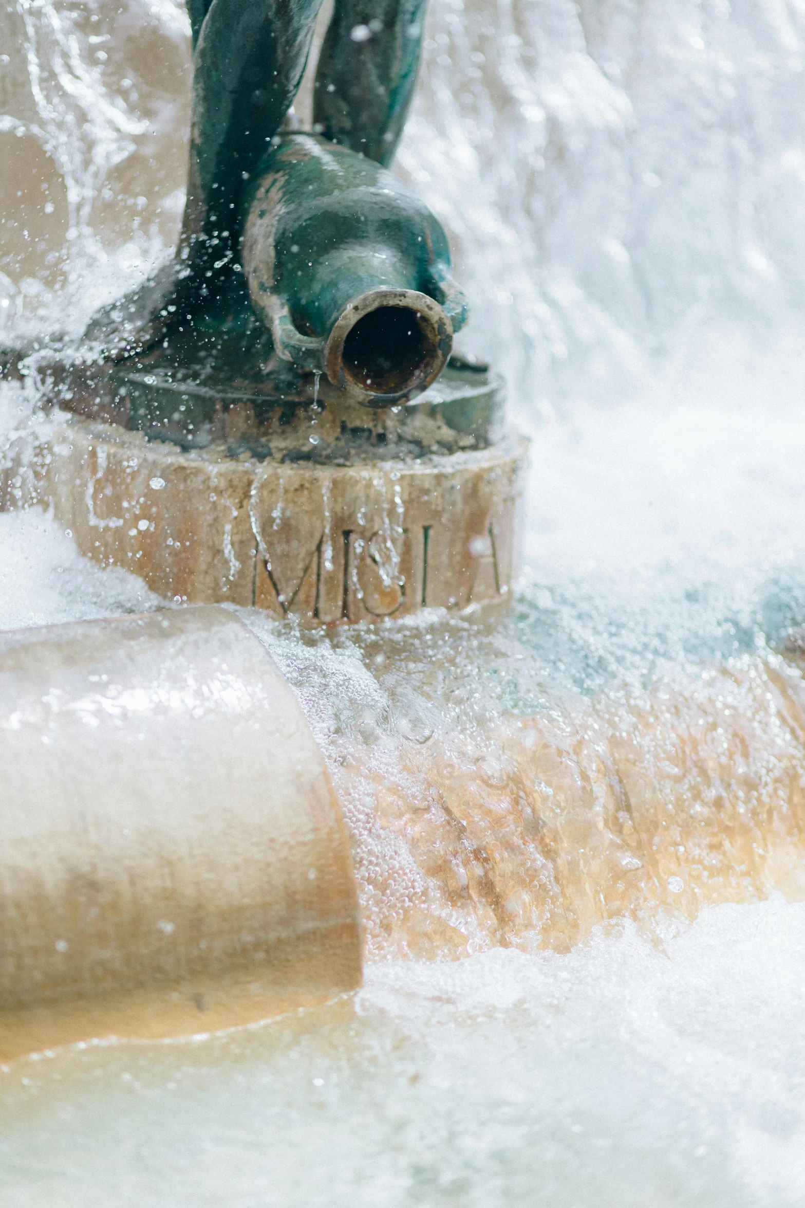 a close up of a fountain with water coming out of it, by Nina Hamnett, renaissance, mining, pool tubes, mill, violent stormy waters