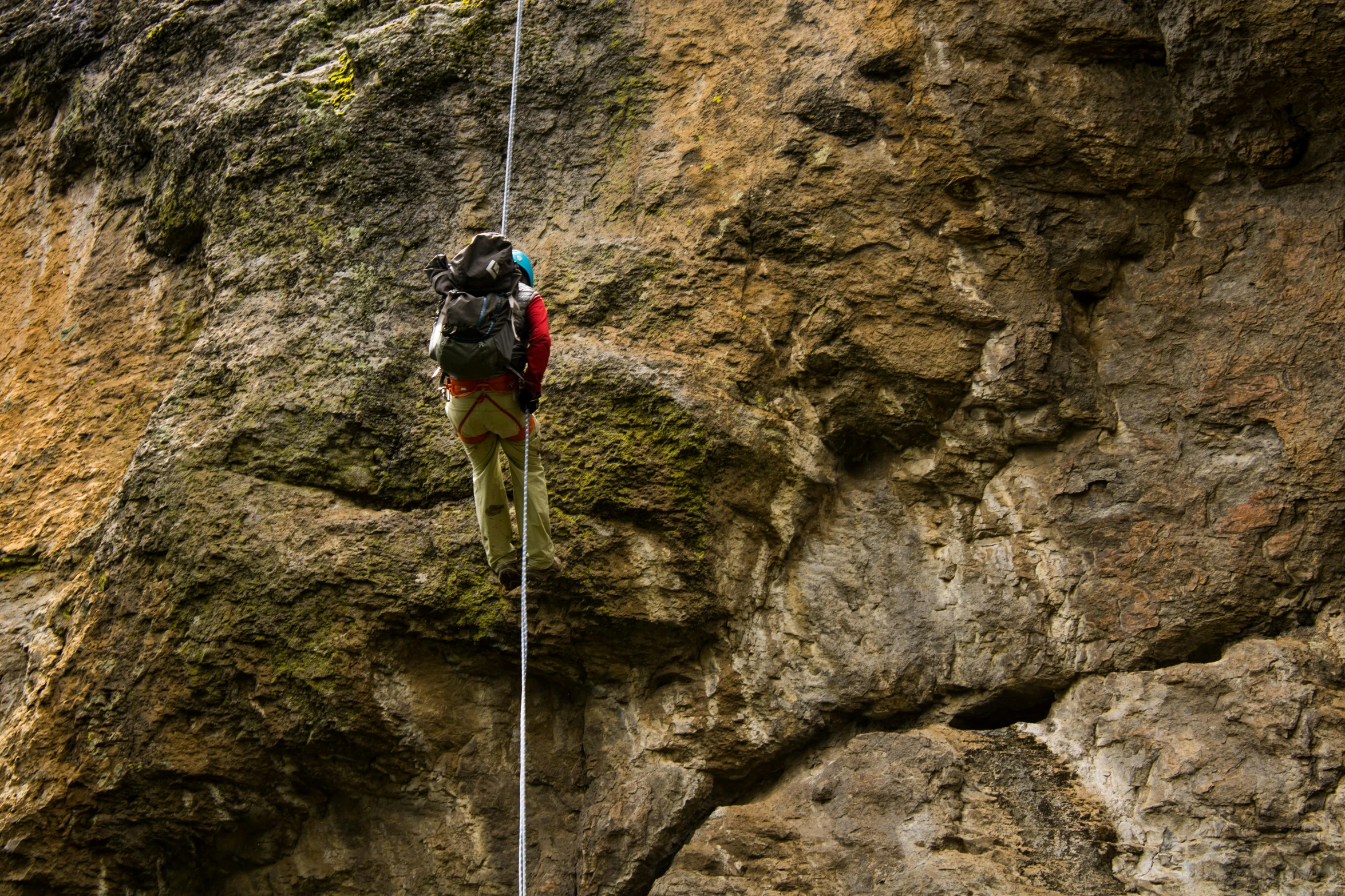 a man on a rock climbing up the side of a cliff, pexels contest winner, renaissance, hanging cables, profile image, in between a gorge, adventure gear