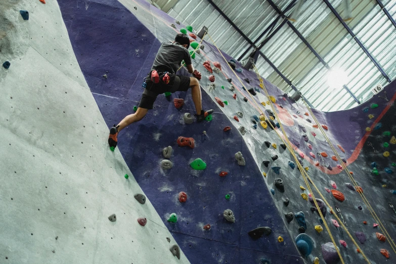 a man is climbing on a rock wall, pexels contest winner, softplay, 15081959 21121991 01012000 4k, high angle vertical, hoang lap