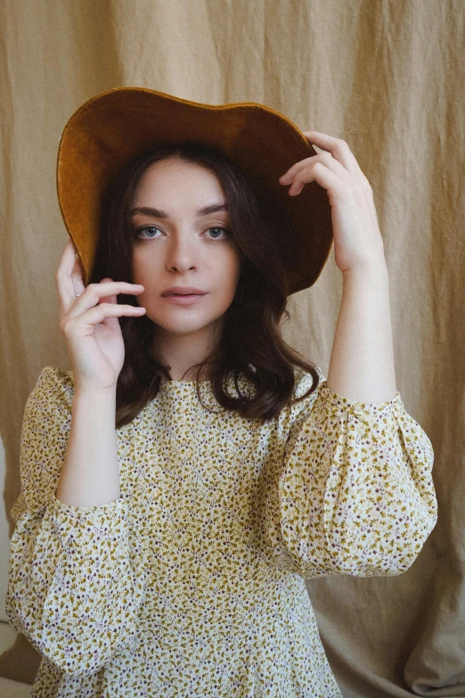 a close up of a person wearing a hat, an album cover, by Lucia Peka, renaissance, wearing yellow floral blouse, natural soft pale skin, girl with brown hair, instagram picture
