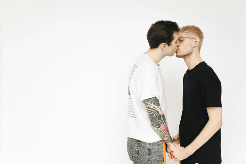 a couple of men standing next to each other, pexels, antipodeans, kissing together cutely, off - white collection, shaven, julia hetta