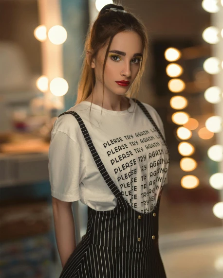 a beautiful young woman standing in front of a mirror, inspired by Elsa Bleda, trending on pexels, happening, in tshirt, suspenders, low quality photo, amouranth