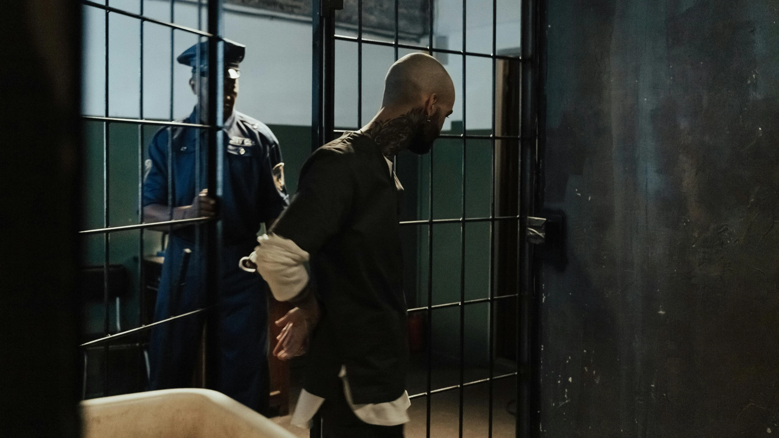 a man with a beard in a jail cell, a tattoo, pexels contest winner, action scene screenshot, mc ride, about to enter doorframe, in court