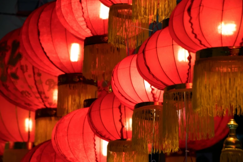 a bunch of red lanterns hanging from a ceiling, inspired by Shang Xi, pexels contest winner, visual art, warm yellow lights, linen, lightshow, pink