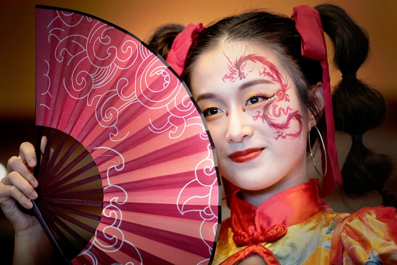 a close up of a person holding a fan, a portrait, inspired by Lan Ying, pexels contest winner, face painting, square, chinese ribbon dance, avatar image