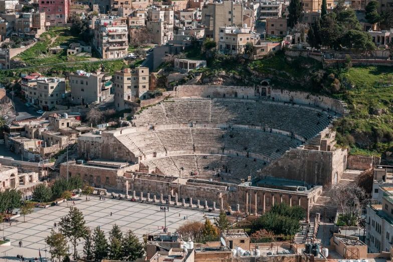 an aerial view of the ancient city of amman, an album cover, pexels contest winner, neoclassicism, stadium full of people, [ theatrical ], gladiator, black