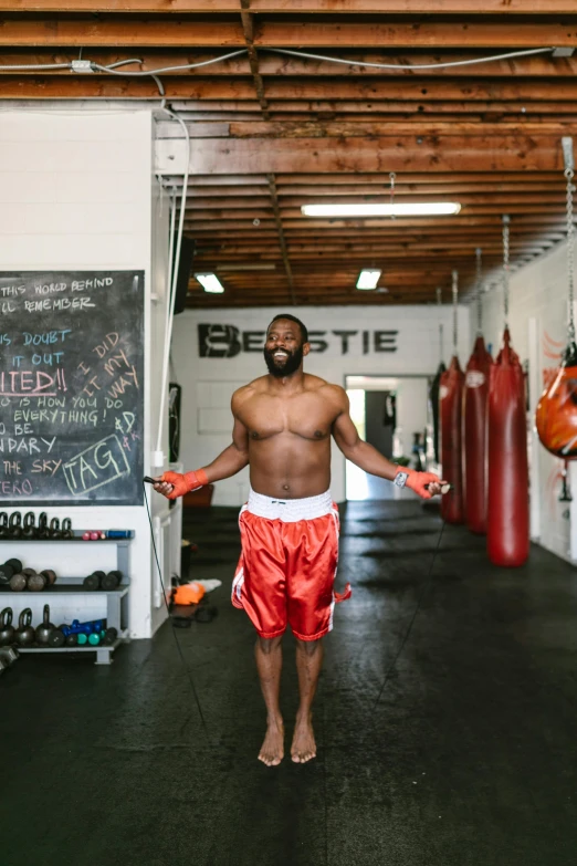 a man standing in the middle of a boxing ring, by Jessie Algie, mc ride, working out, profile image