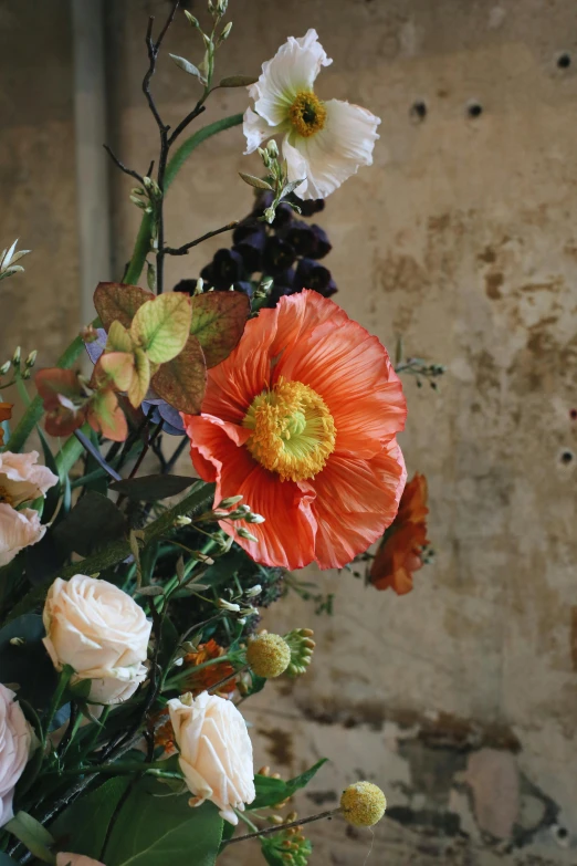 a close up of a vase of flowers on a table, a still life, by Elsie Few, unsplash, baroque, dead but beautiful. poppies, hannah af klint, rustic setting, beautiful sculpted details