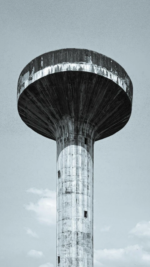 a black and white photo of a water tower, an album cover, unsplash contest winner, brutalism, round-cropped, in retro colors, soviet brutalism, july 2 0 1 1