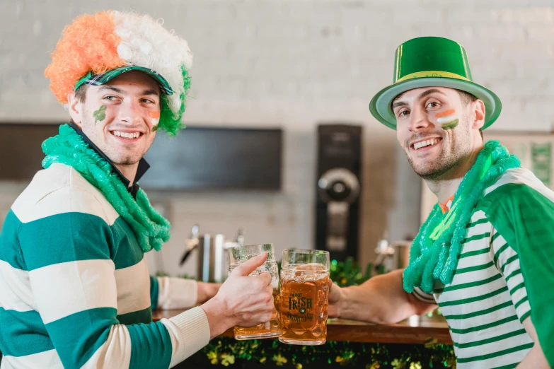 two men celebrating st patrick's day at a bar, pexels contest winner, authentic costume, striped, aussie baristas, 🦩🪐🐞👩🏻🦳