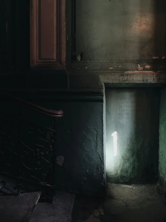 a dark room with a light shining through the window, inspired by Elsa Bleda, hogwarts stairwell, pale green glow, by emmanuel lubezki, promo image