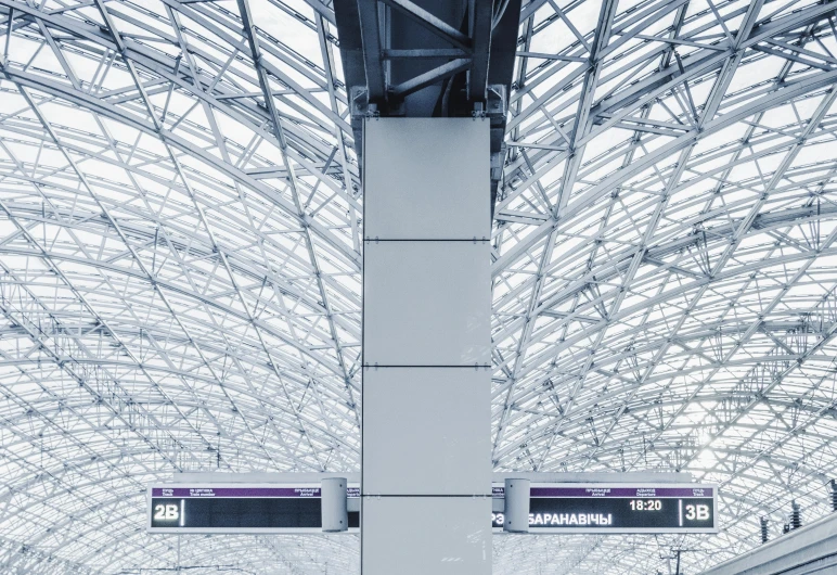 a group of people walking through a train station, unsplash, white and purple, sky made of ceiling panels, truss building, ivan aivakovsky