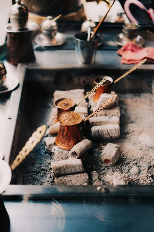 a close up of a tray of food on a stove, a still life, trending on unsplash, process art, ancient coffee machine, turkey, marshmallow, thumbnail