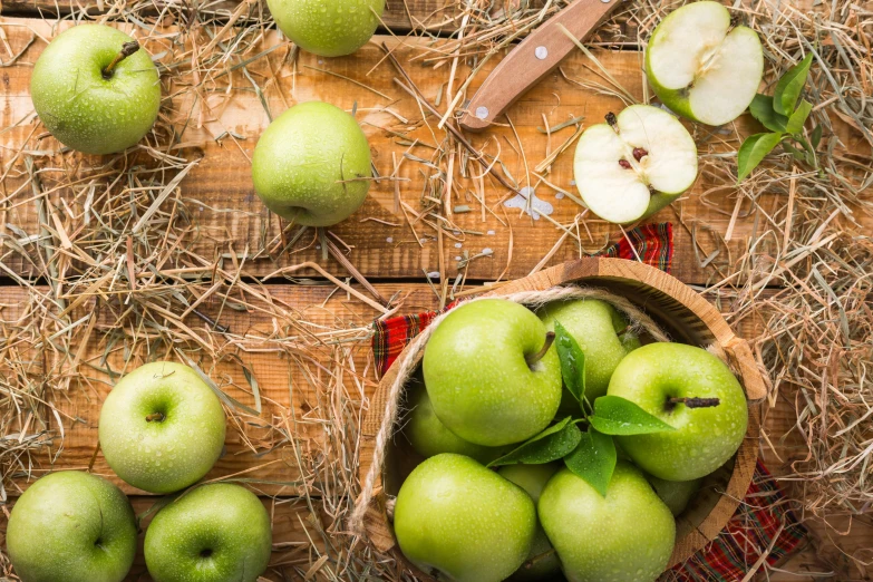 a wooden crate filled with lots of green apples, a still life, shutterstock, renaissance, flatlay, background image, apple pie, grain”