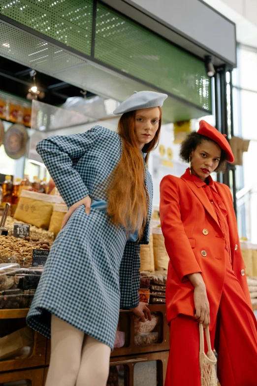 a couple of women standing next to each other, trending on pexels, in style of tim walker, merchants, in retro colors, bustling