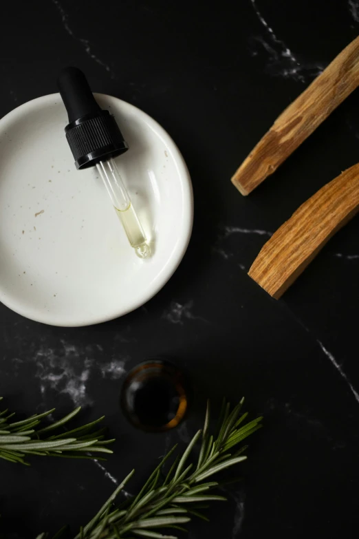 a couple of toothbrushes sitting on top of a white plate, a still life, inspired by Ceferí Olivé, trending on pexels, black oil bath, wooden bowl, maple syrup highlights, thumbnail